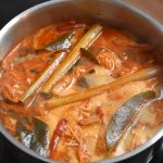 Tom Yum Aromatics simmering in a stainless steel pot