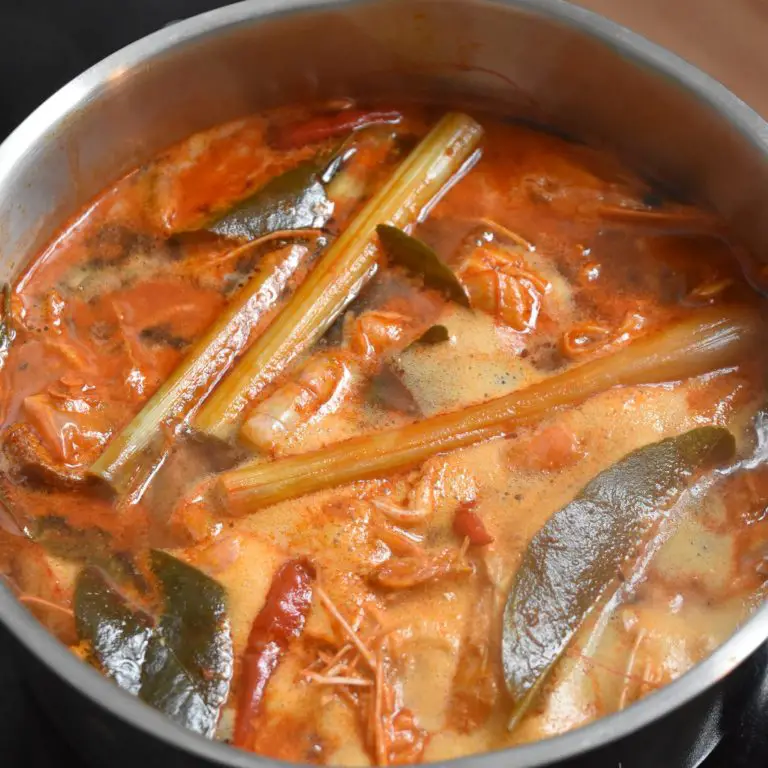 Tom Yum Aromatics simmering in a stainless steel pot