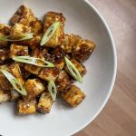 crispy honey and garlic tofu bites on a plate